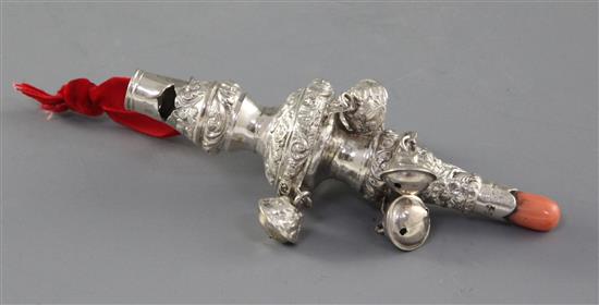 A William IV embossed silver childs rattle with coral teether, by Unite & Hilliard, 11.5cm.
